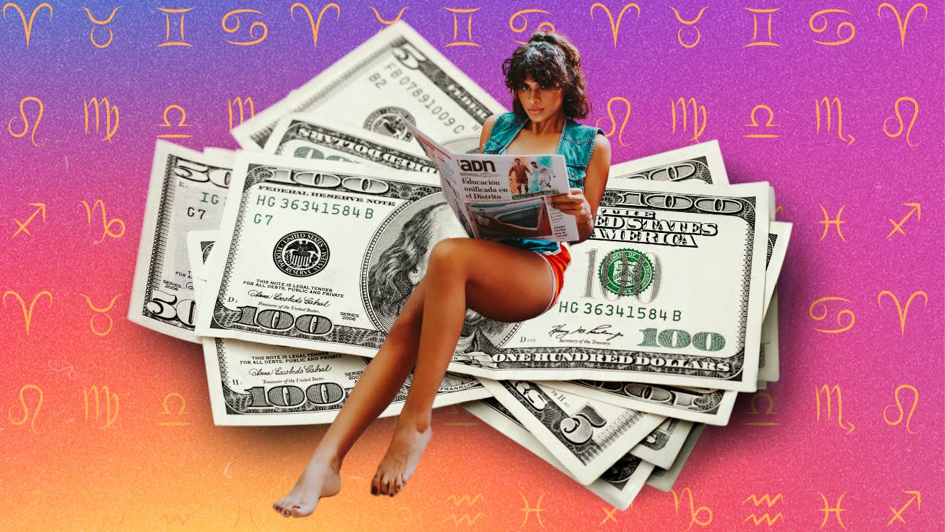 woman sitting on pile of money