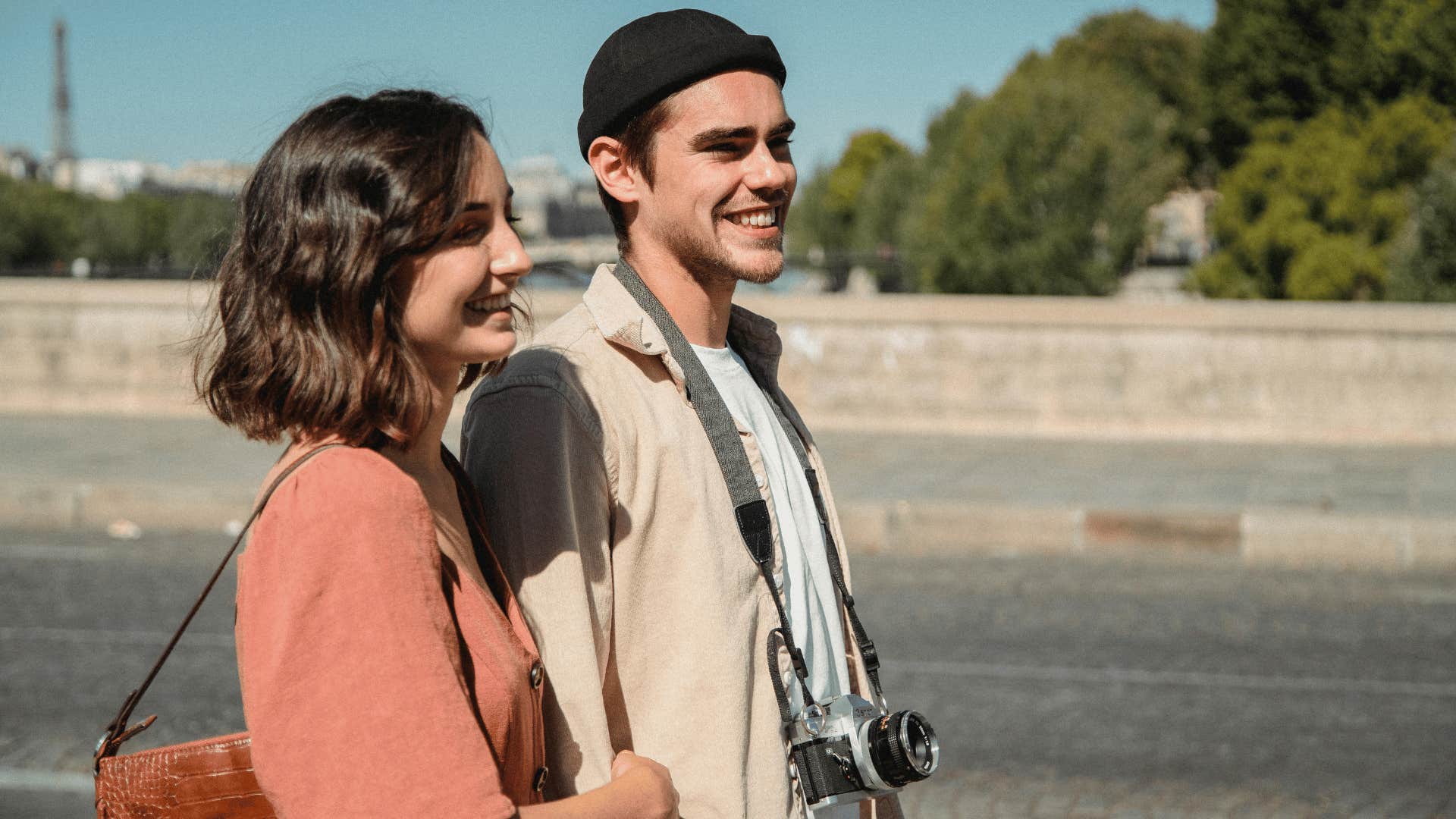 happy couple walking down street together