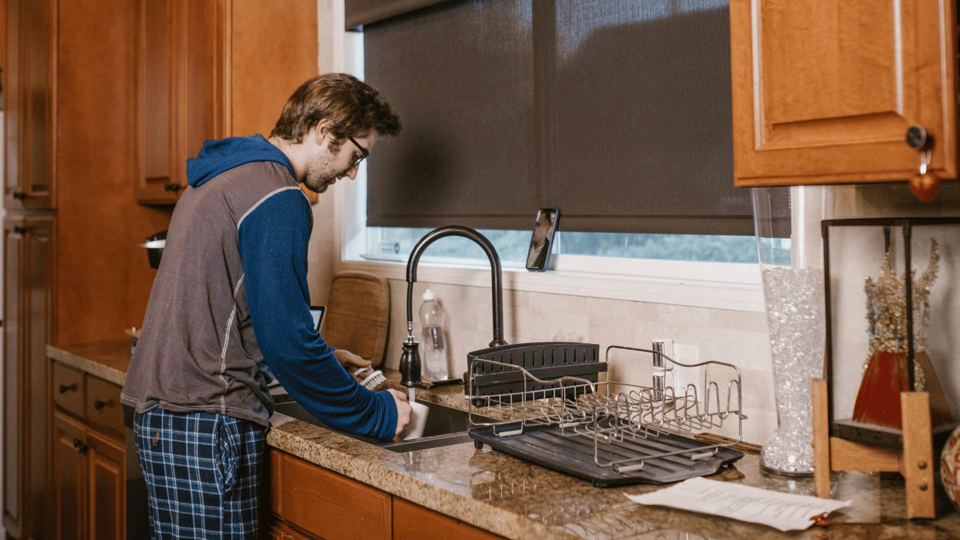 man washing dishes