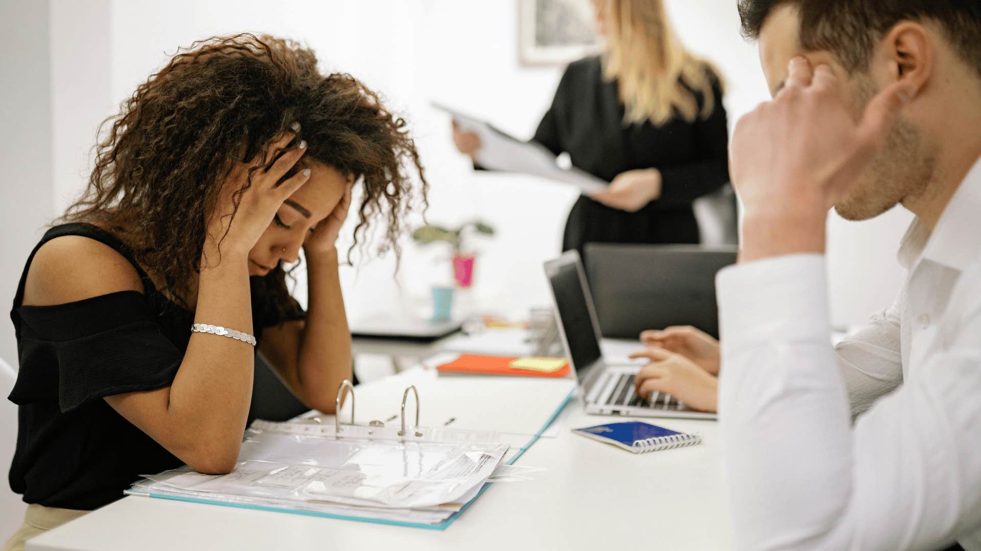 stressed woman in work meeting