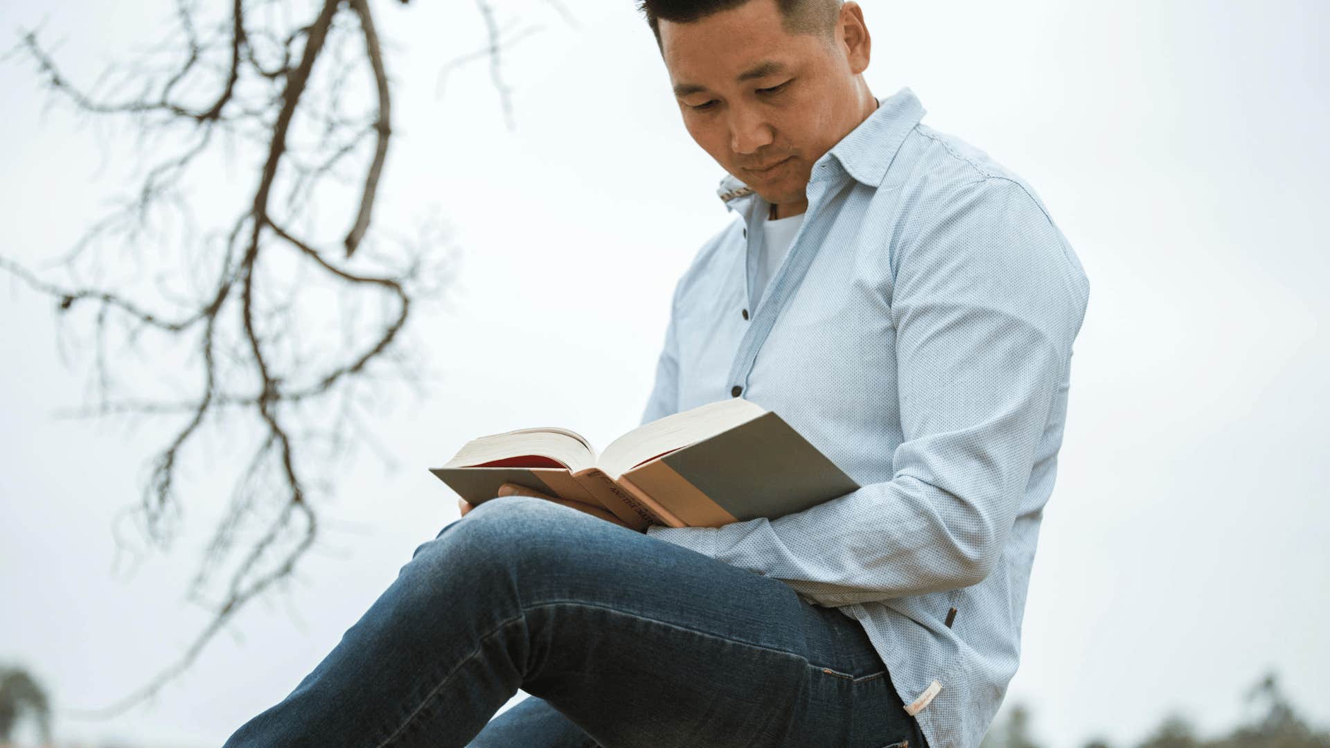 man reading outdoors