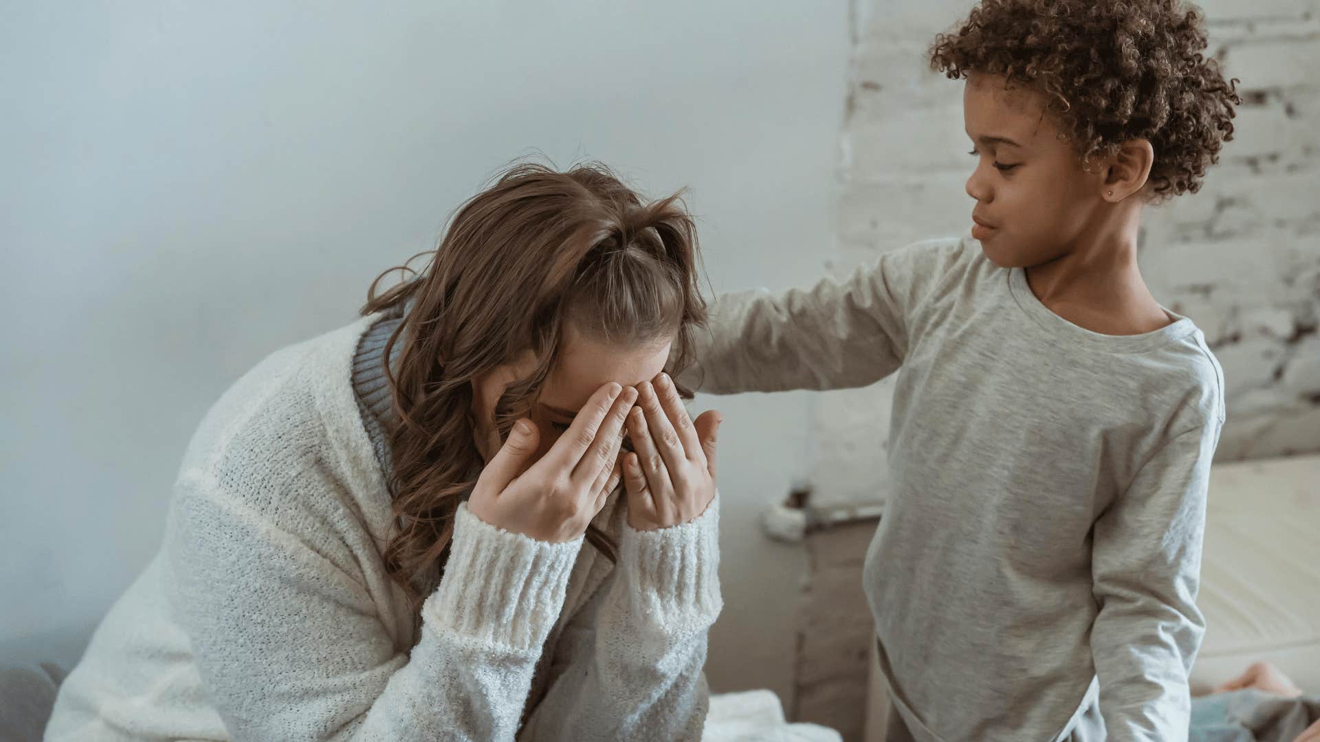 child comforting upset woman