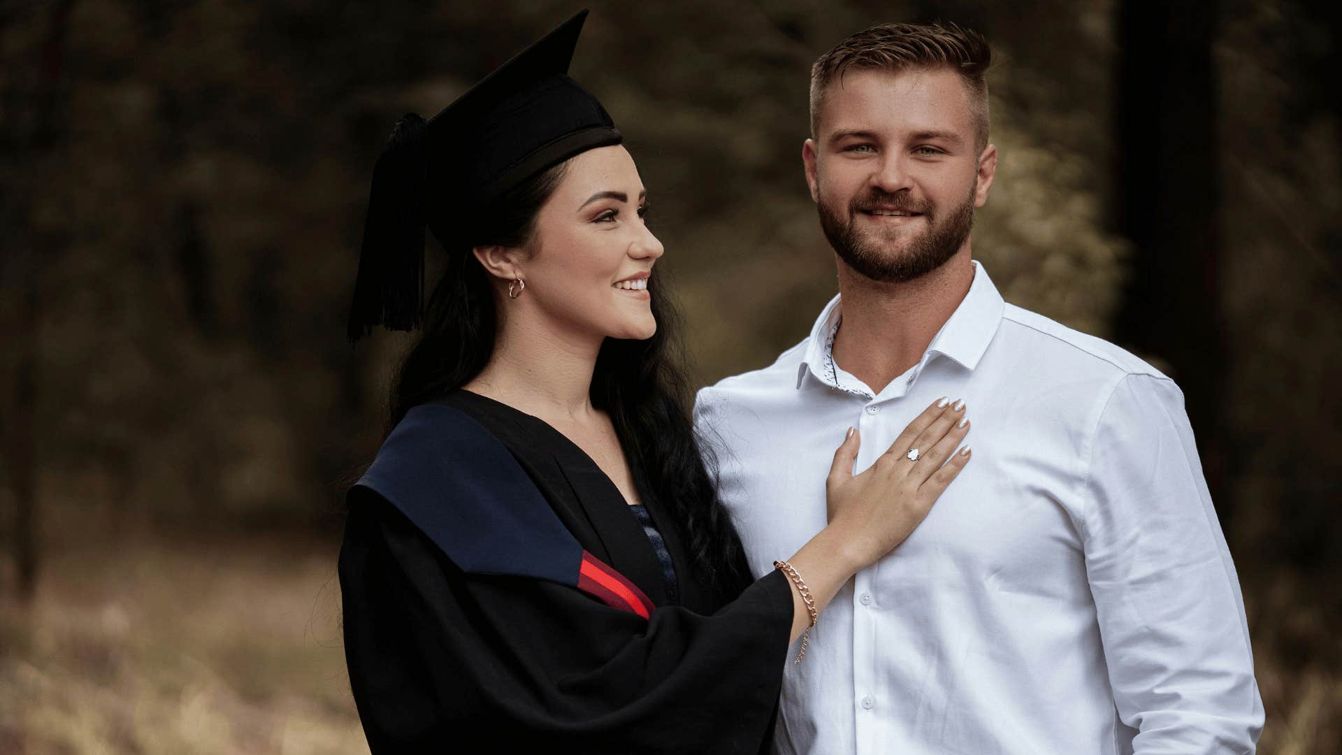 graduating woman smiling at man