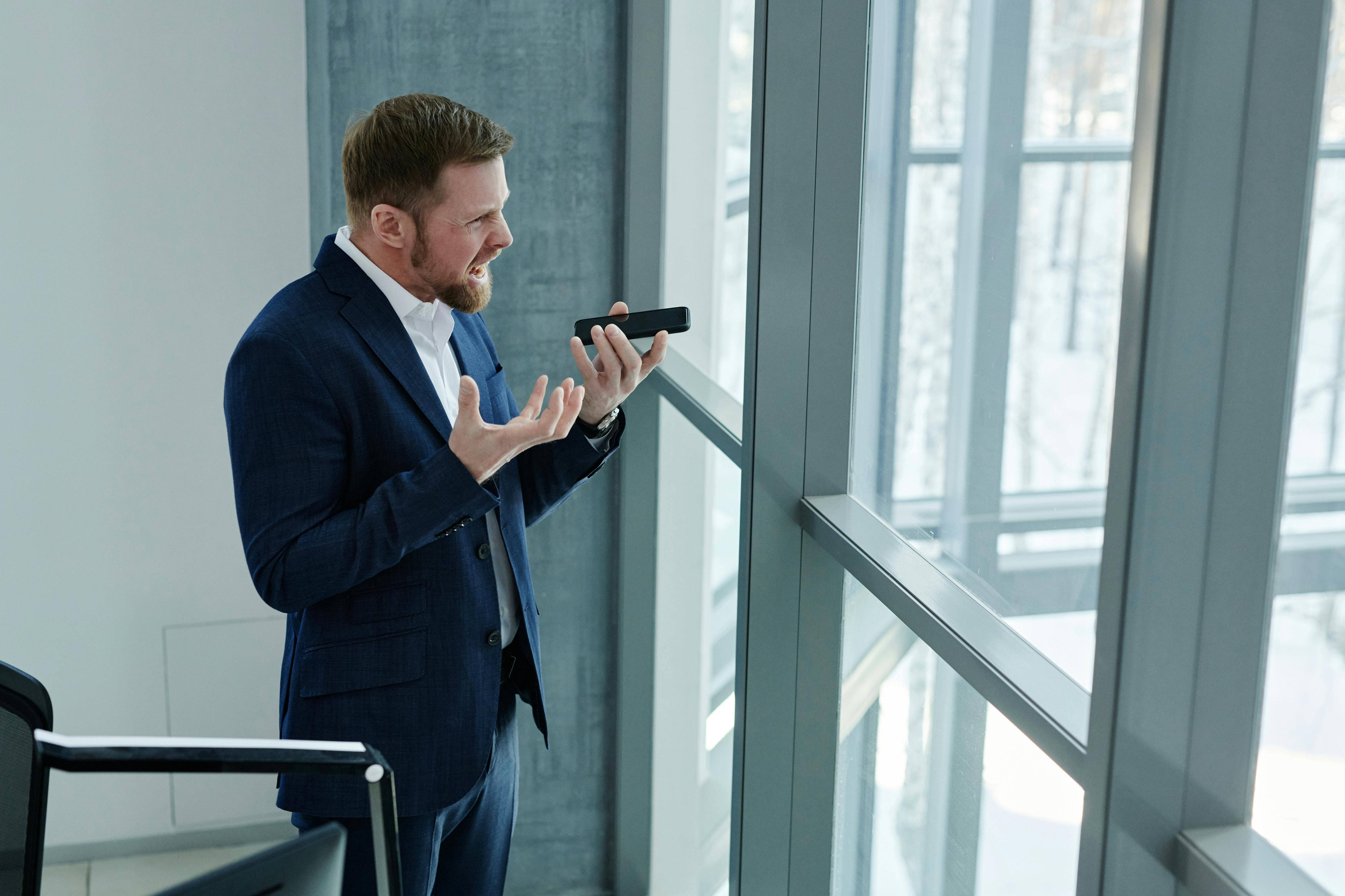 angry man speaking on phone