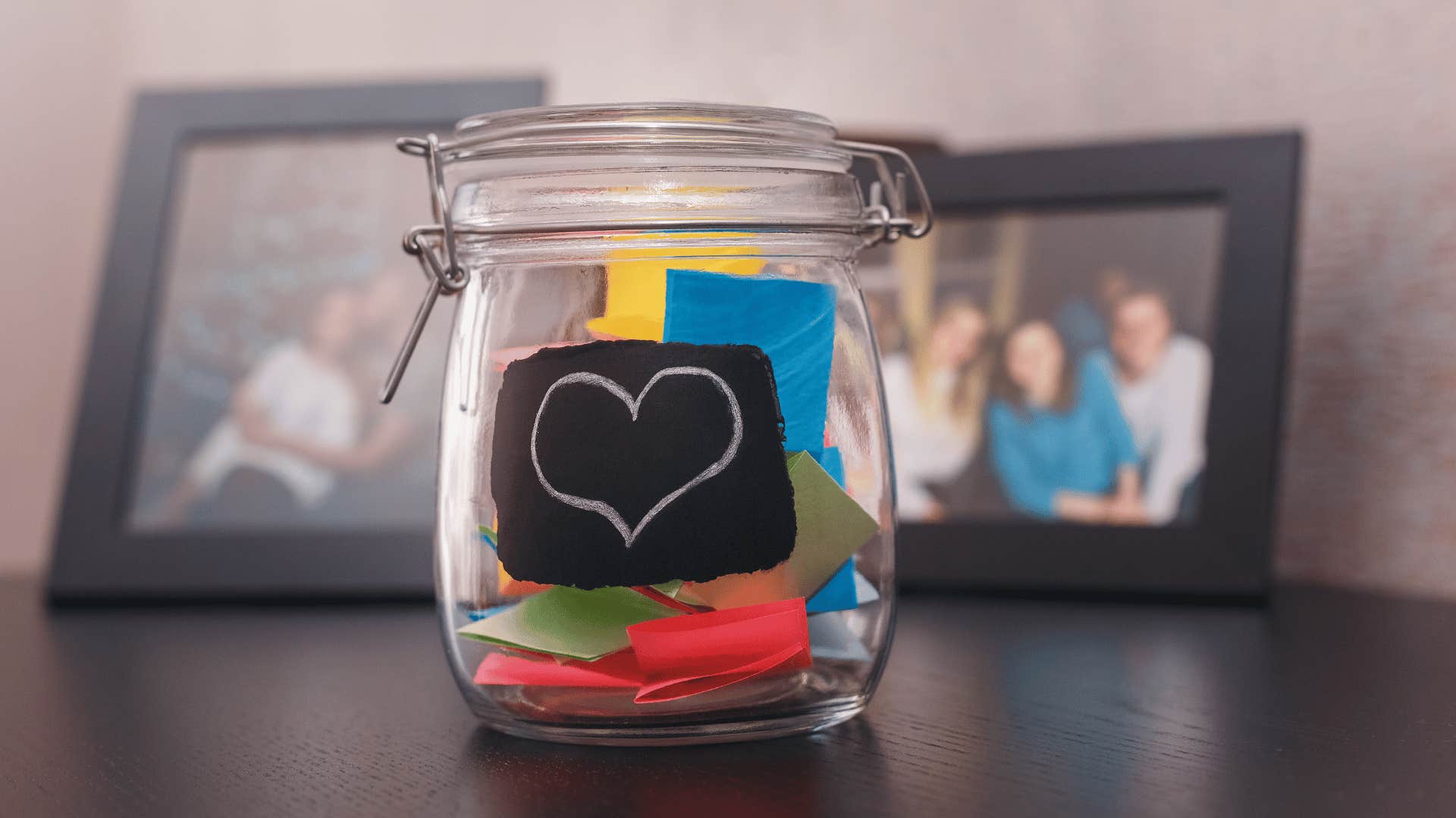 folded colored paper in glass jar