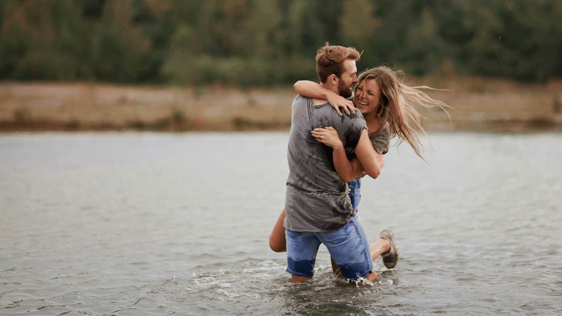 playful couple in lake