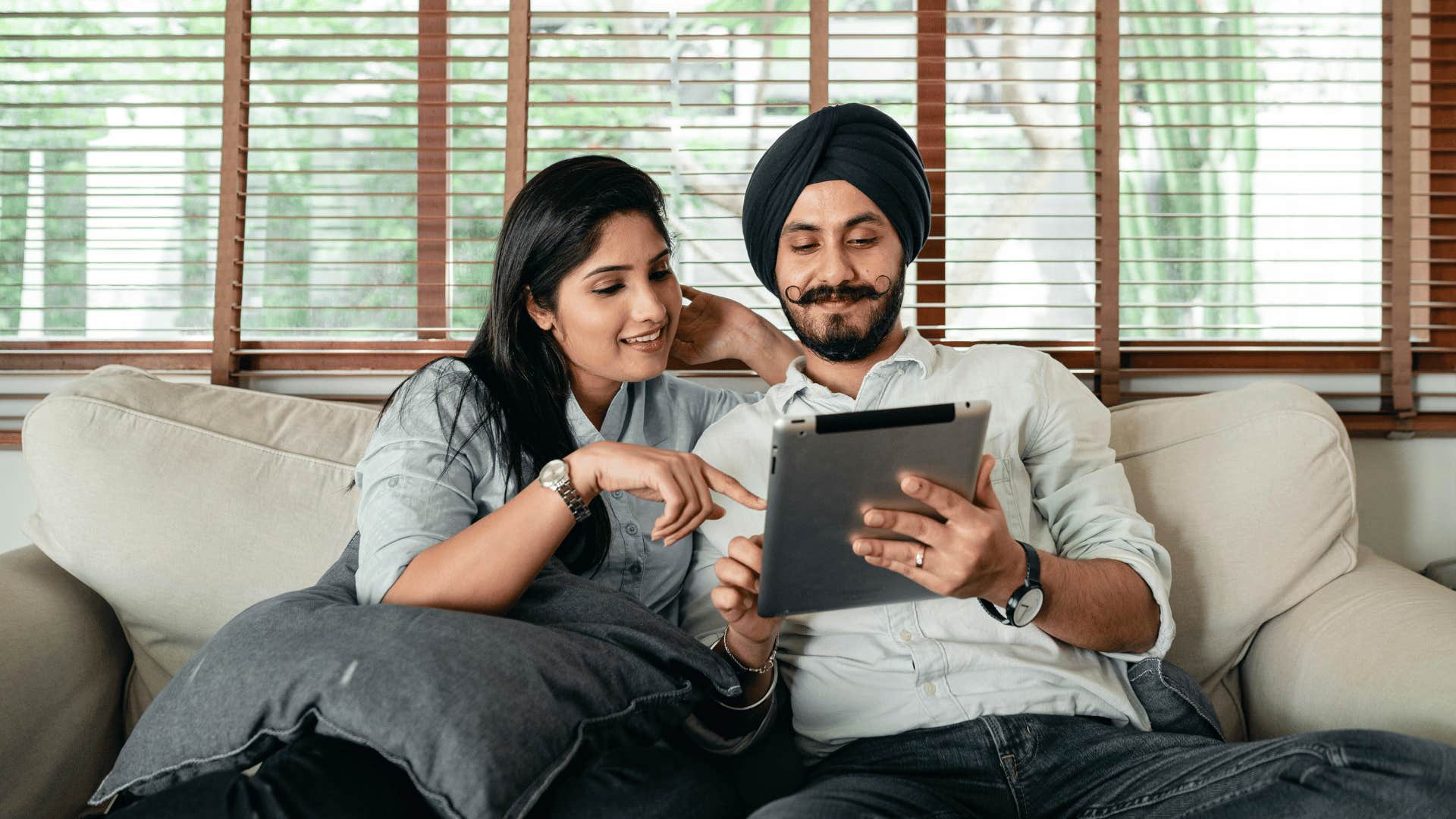 couple looking at tablet together