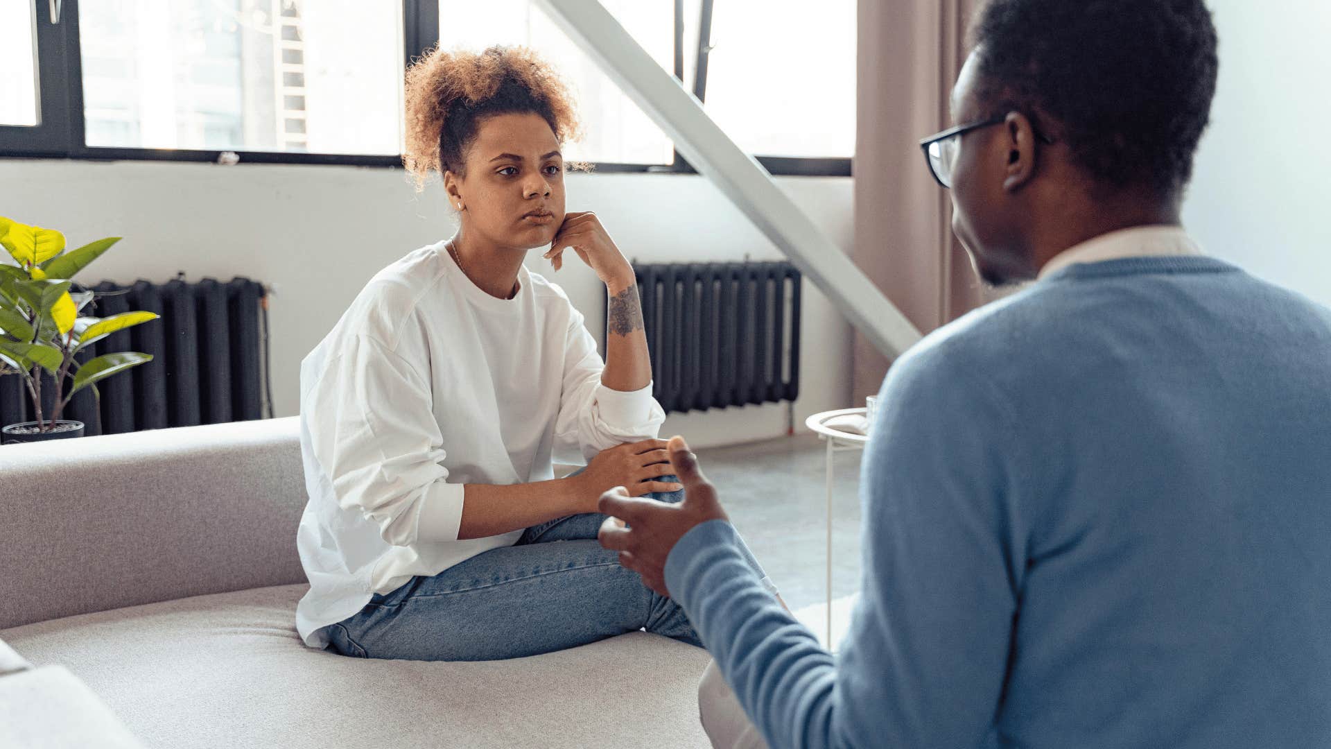 woman listening to man speaking