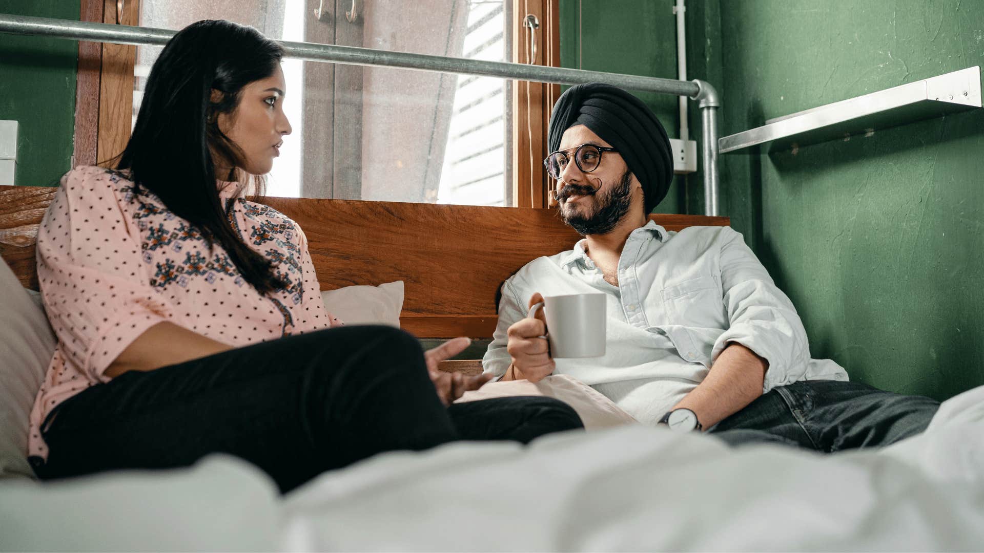 couple having a calm conversation on couch