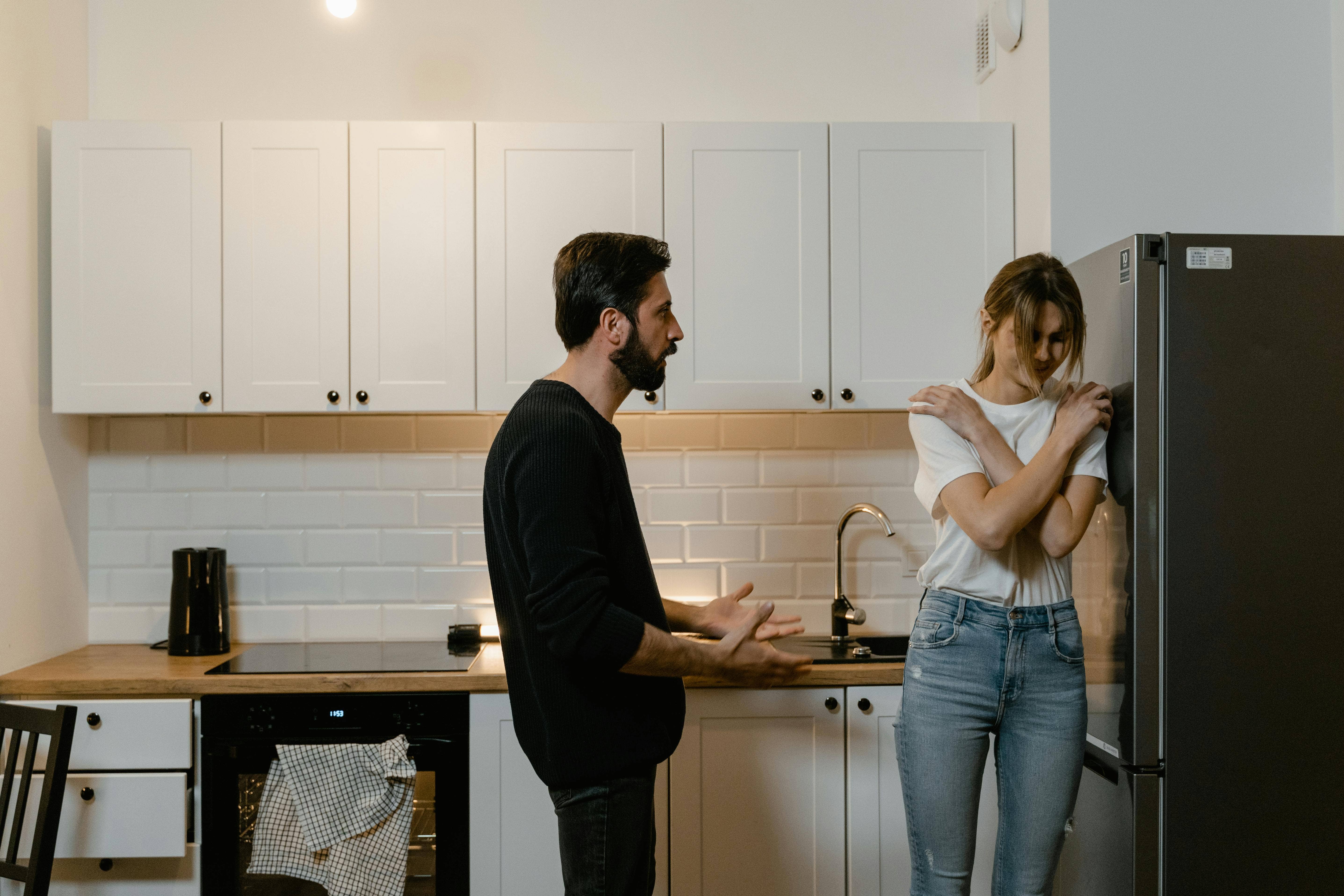 couple arguing in kitchen