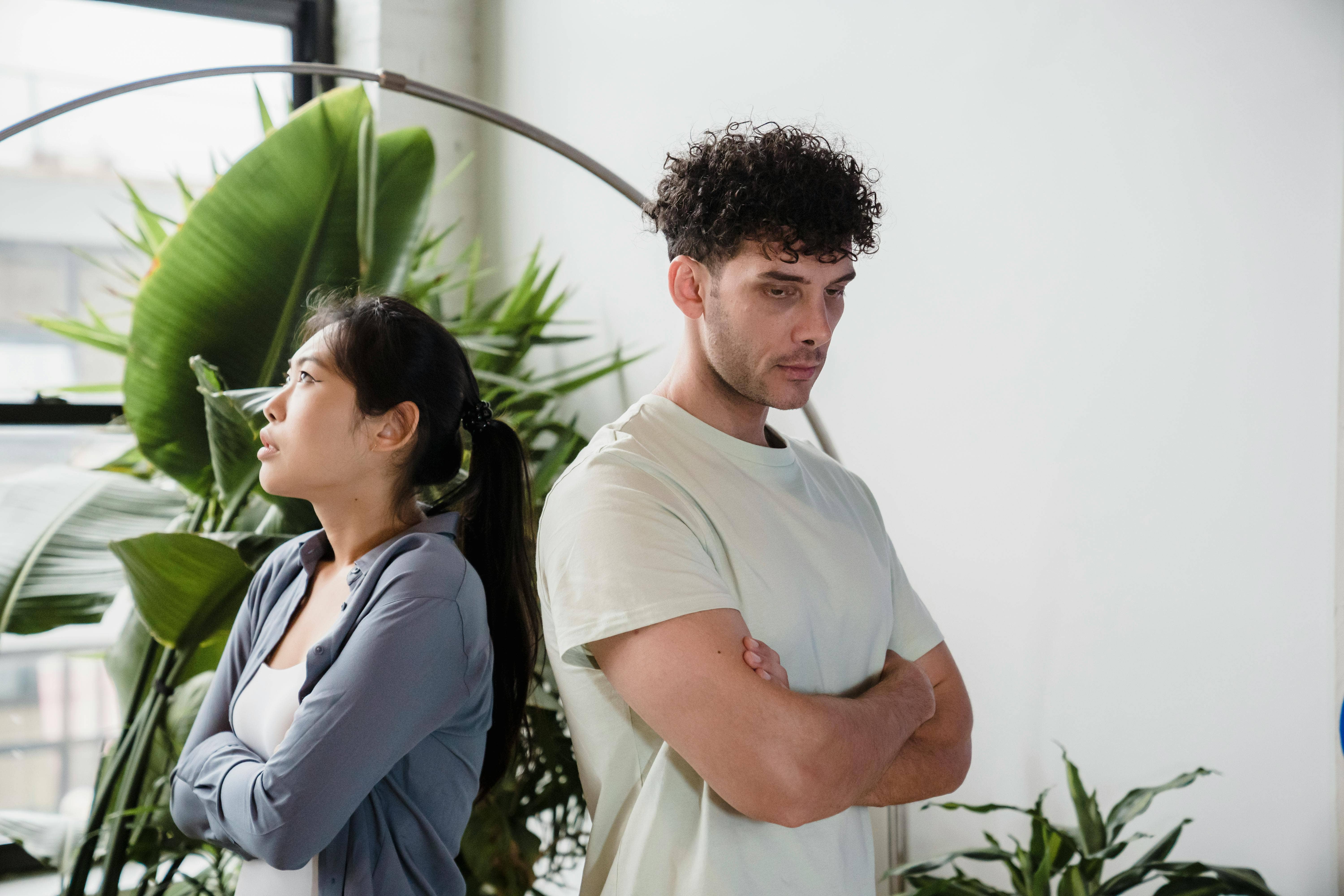 man and woman turned away from each other