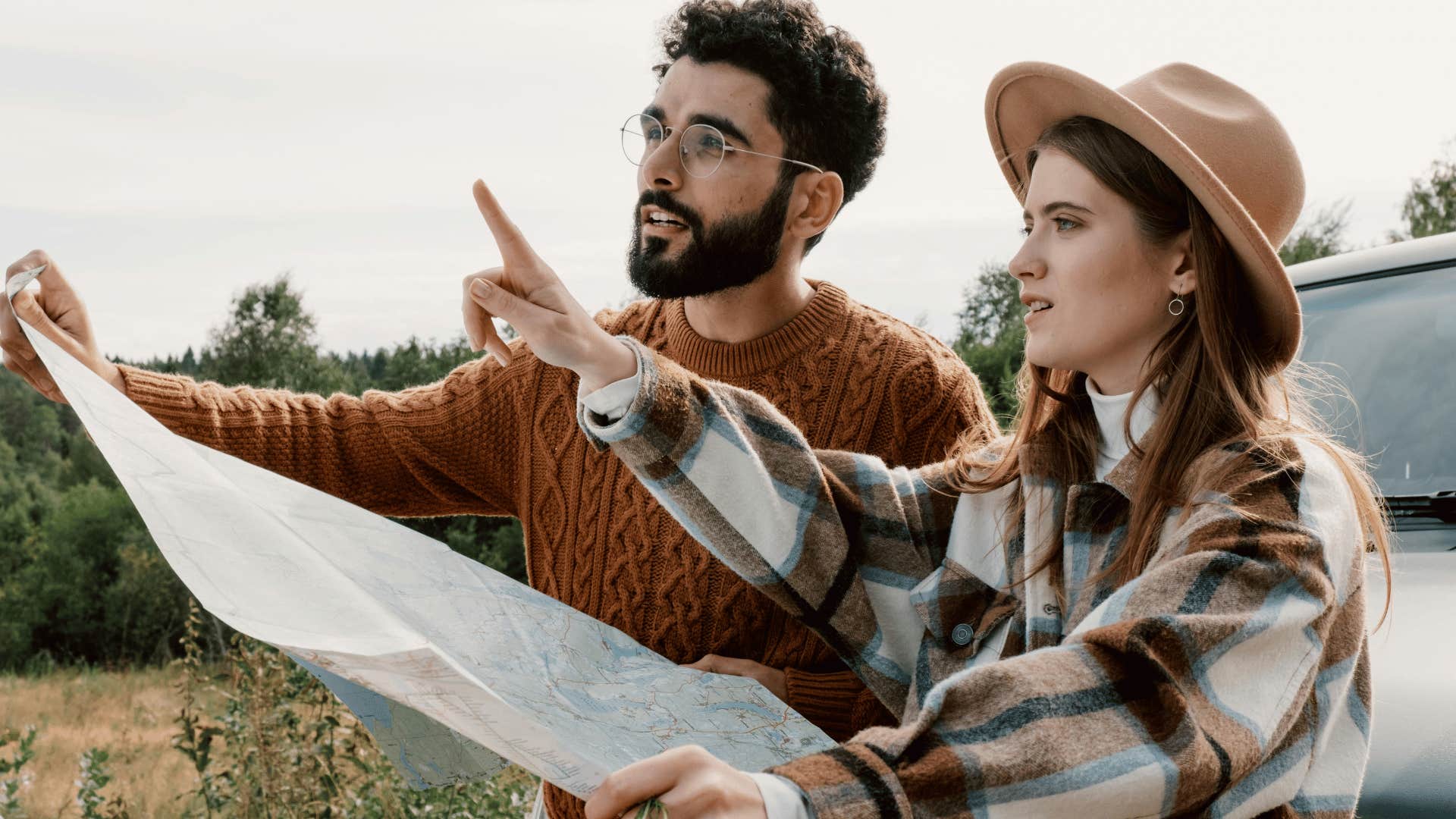 lost couple looking at map for directions