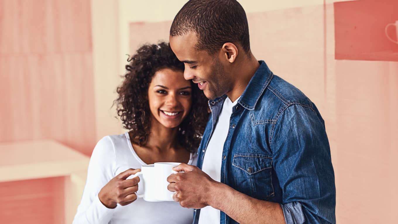 A woman cuddling her man, drinking coffee, figuring out what he truly needs