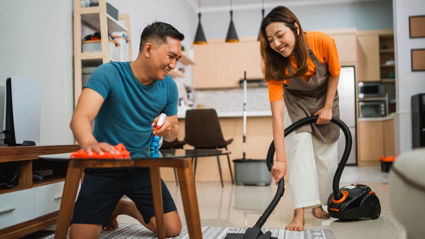 happy couple doing house chores together