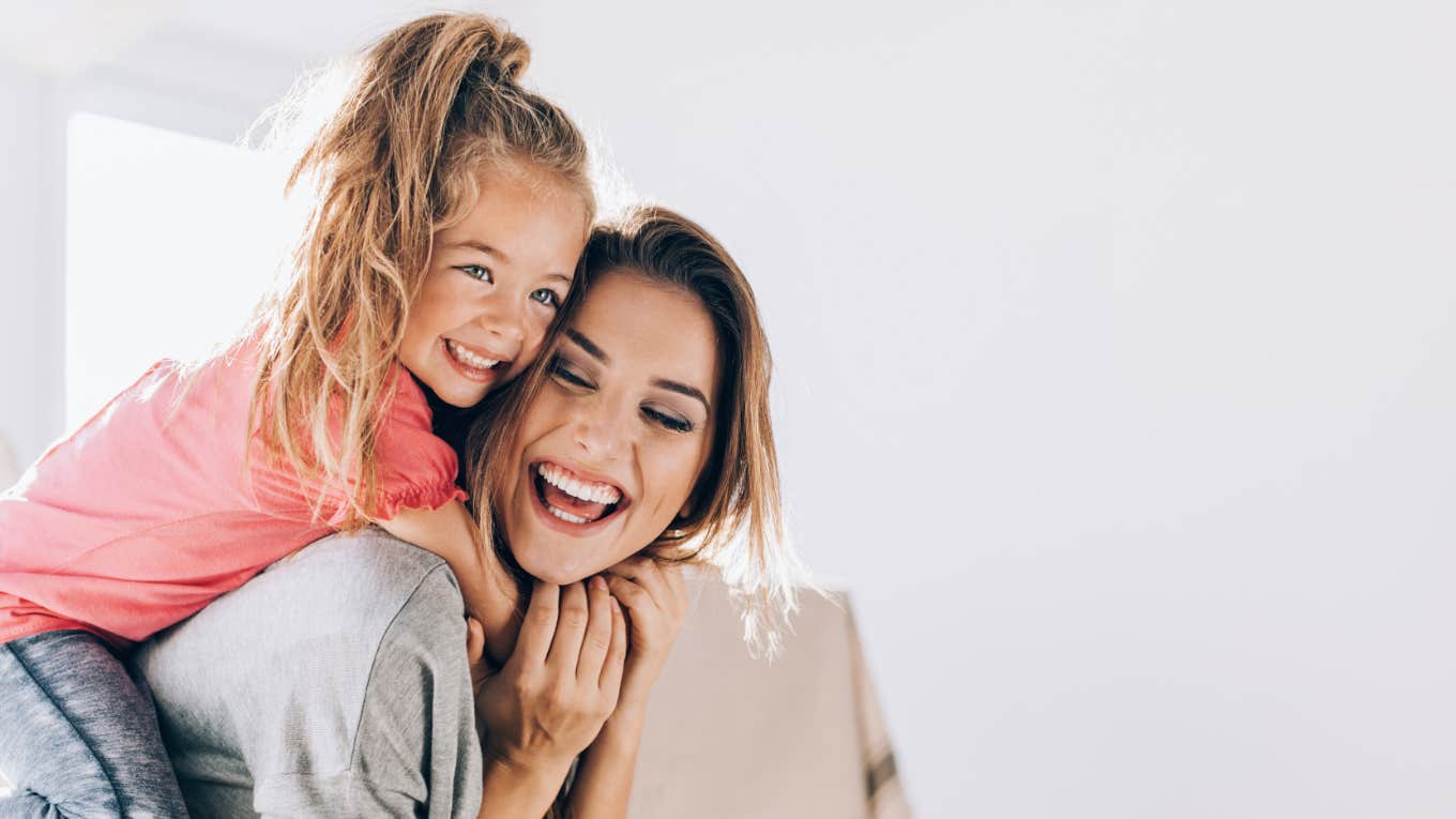 mom and daughter laughing and connecting at home