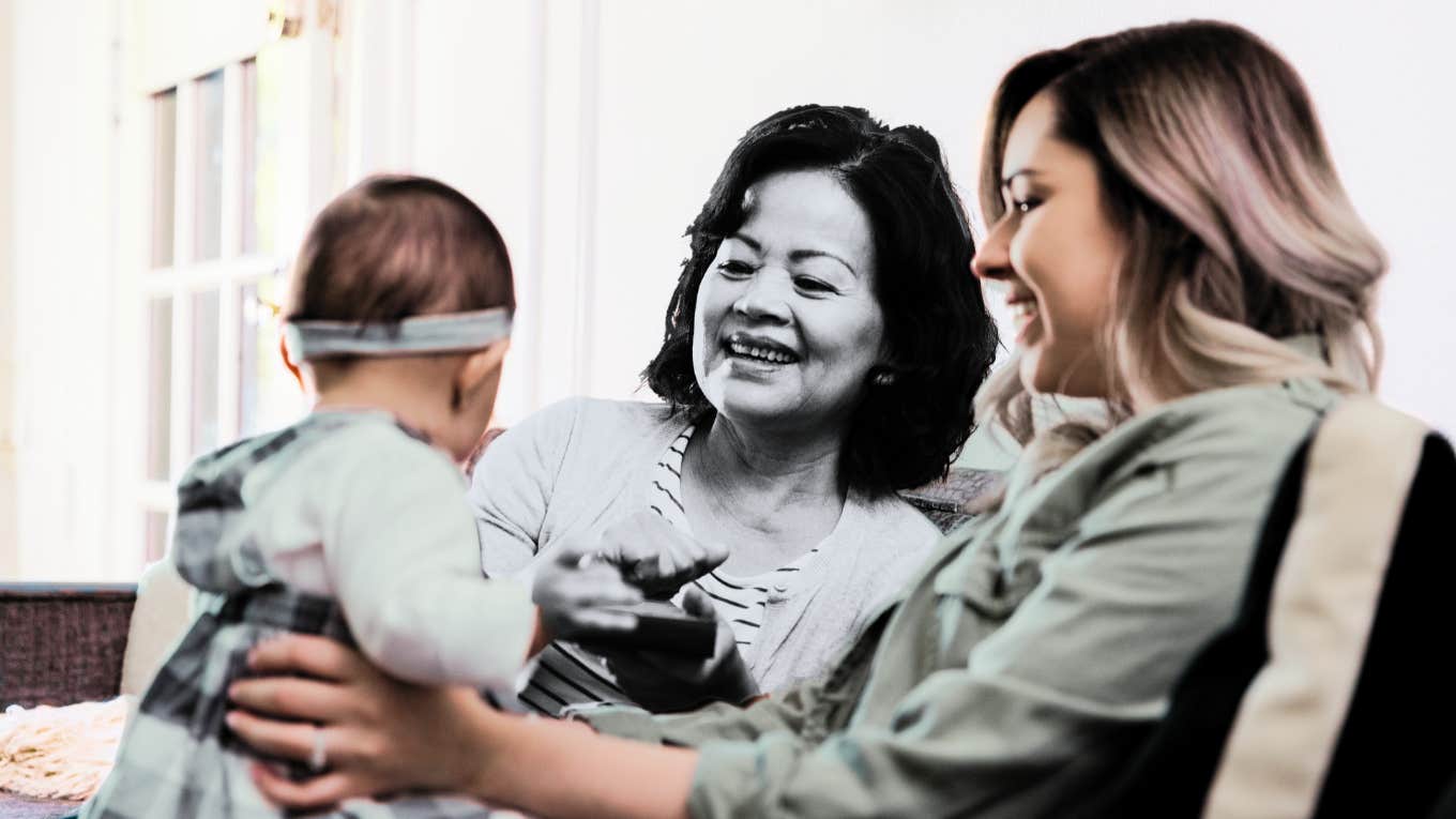 Mother in law visiting baby grandchild