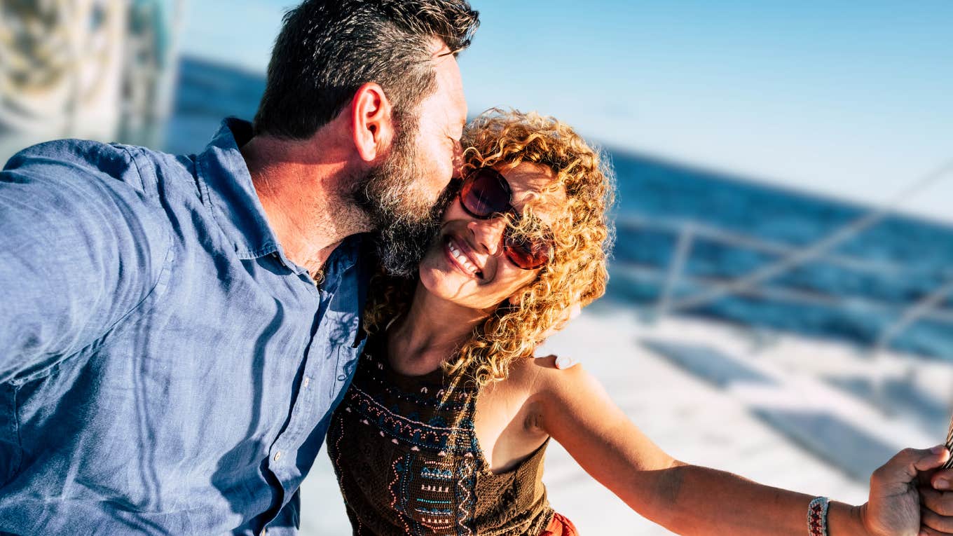 Man kissing woman's cheek in a relationship that will survive