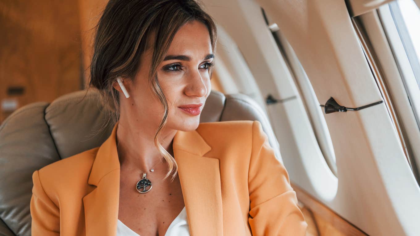 Young woman sitting on a plane