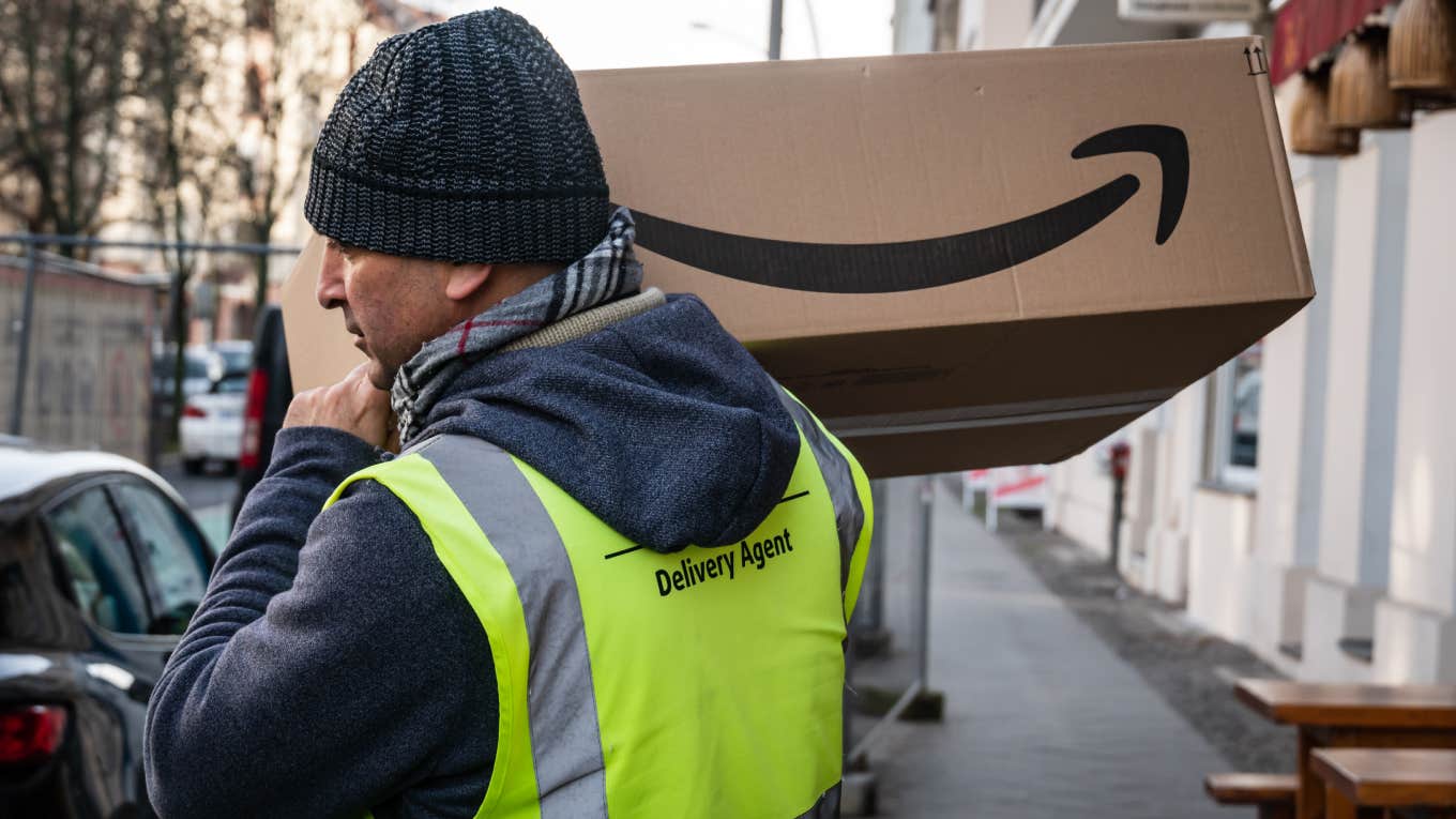 amazon worker carrying package