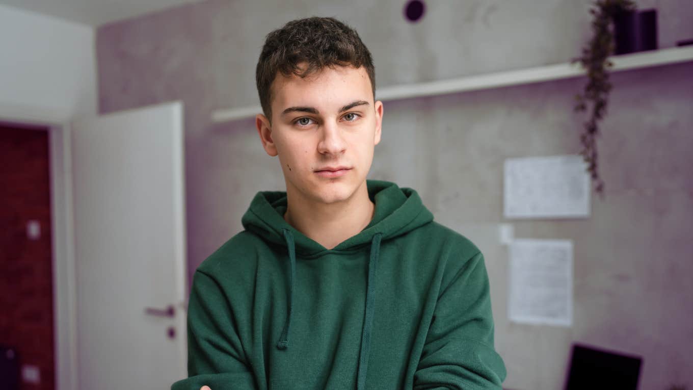 Teen in dorm room looking like teenagers today 