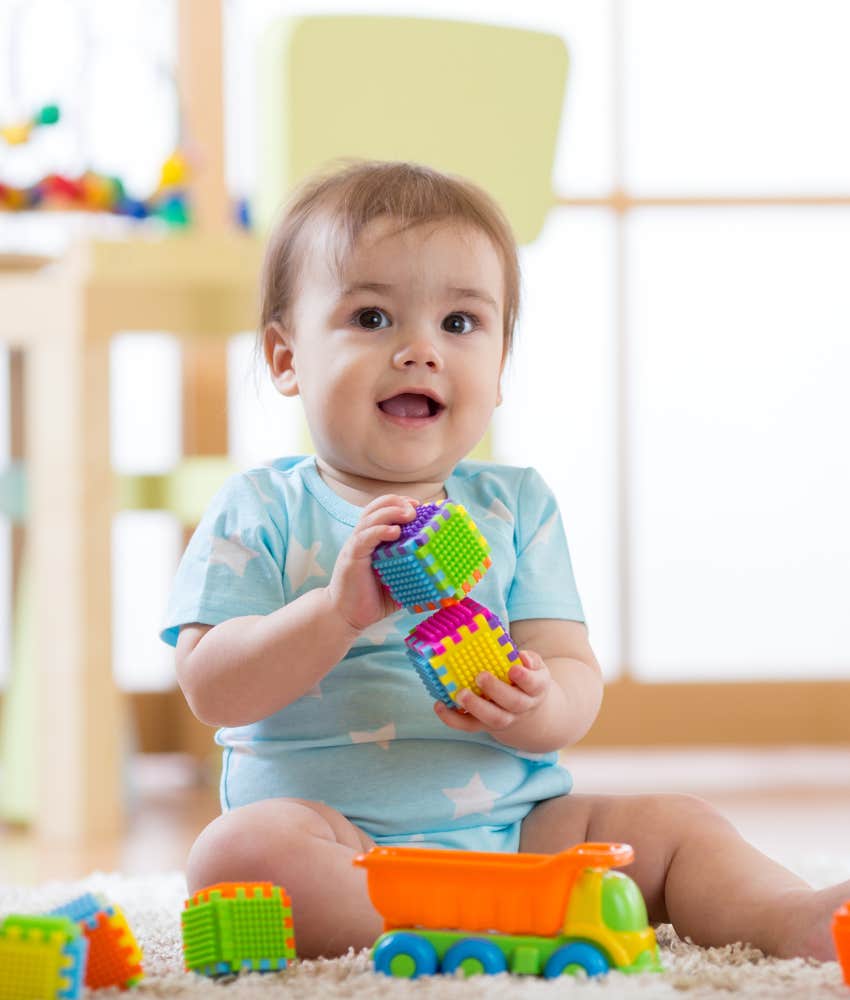 baby playing with blocks