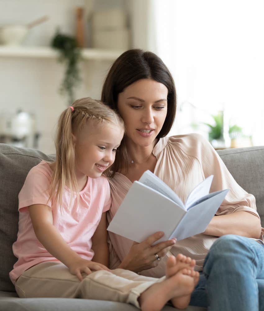 babysitter reading with little girl