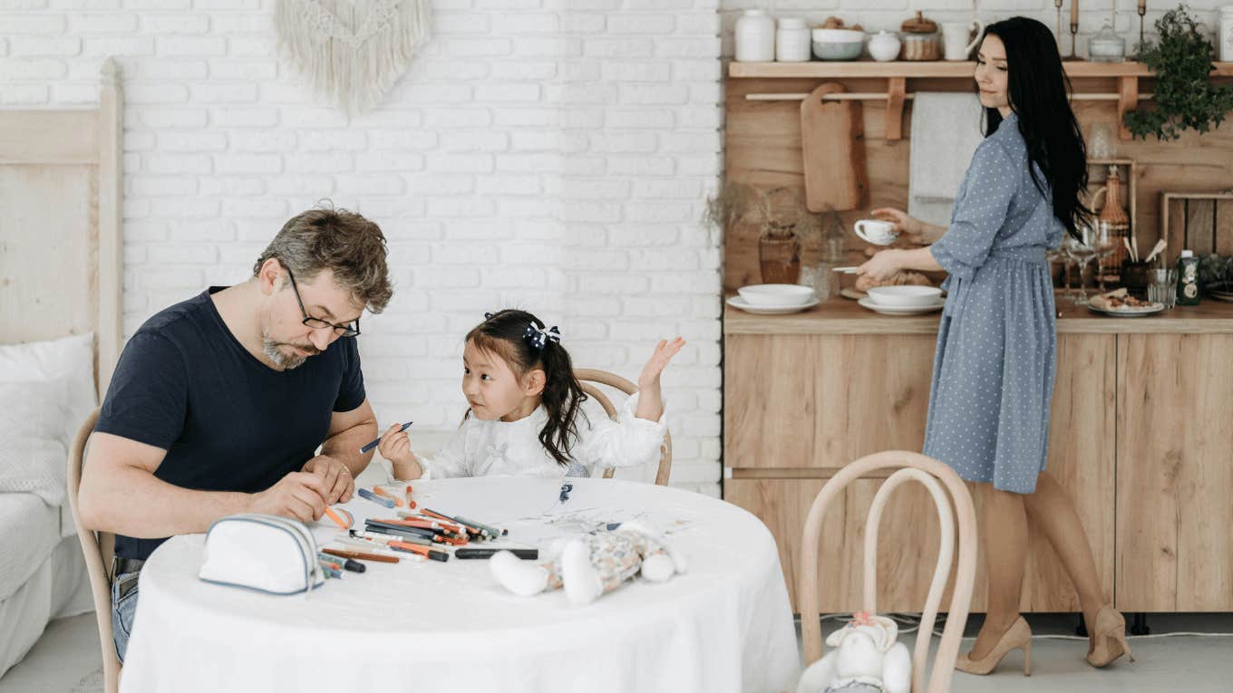 mom, dad, and daughter in kitchen