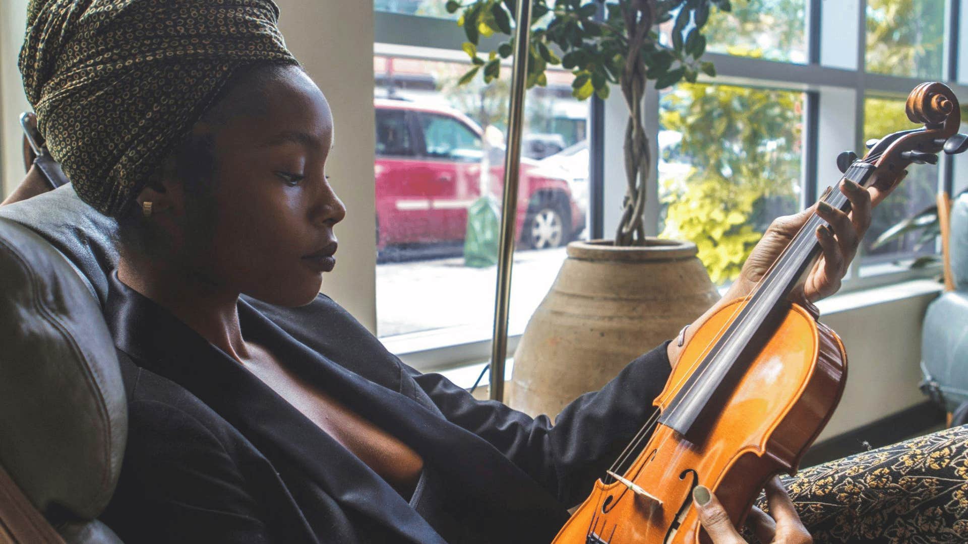 musician looking at her violin