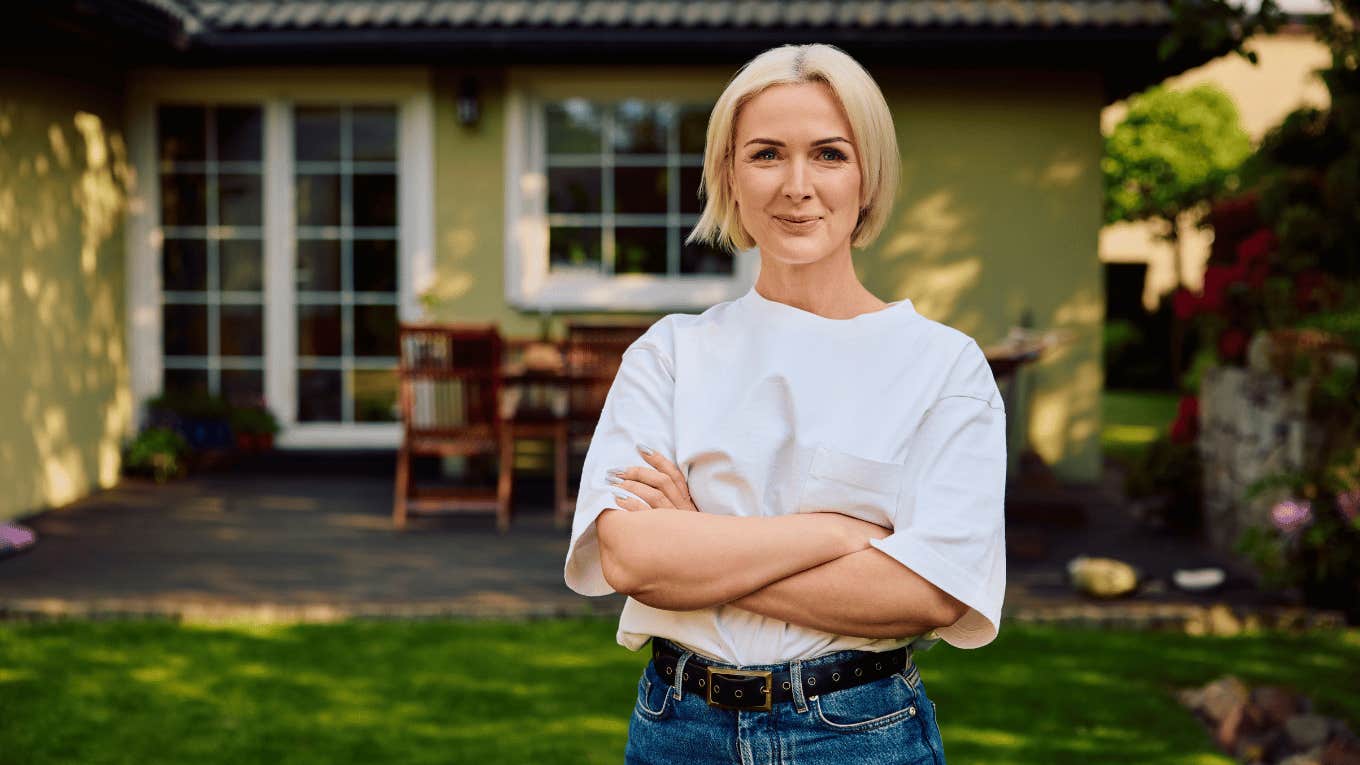 woman standing outside home