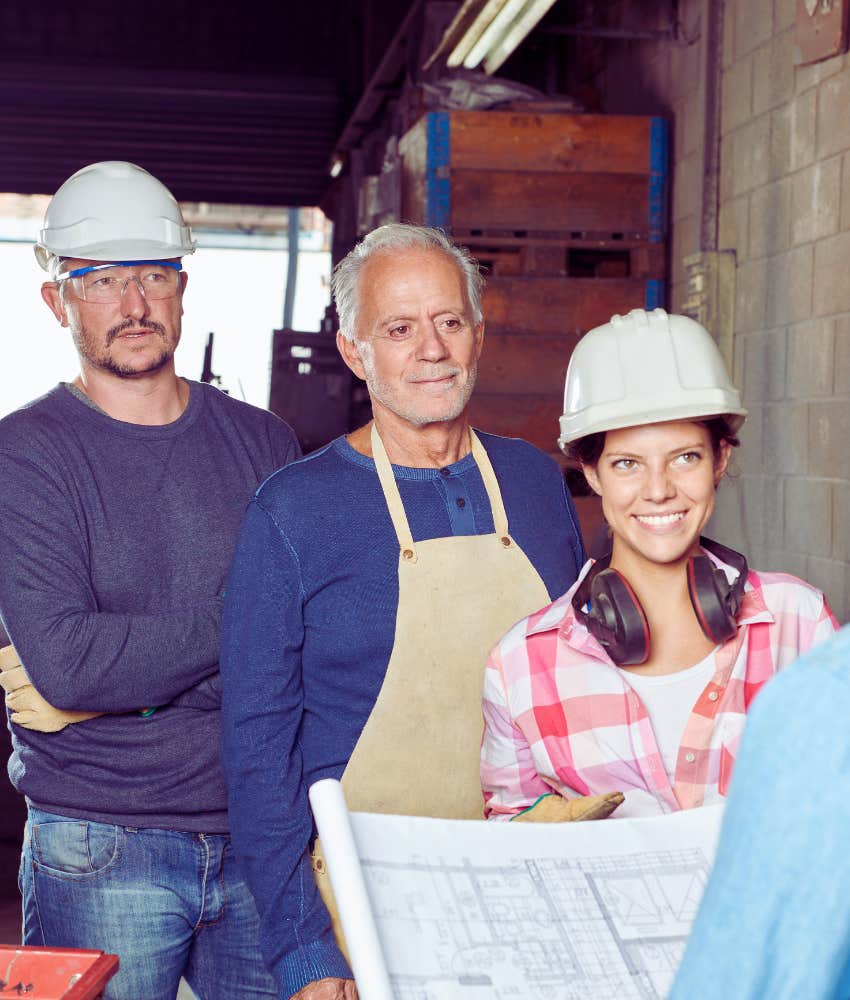 blue-collar workers listening to co-worker