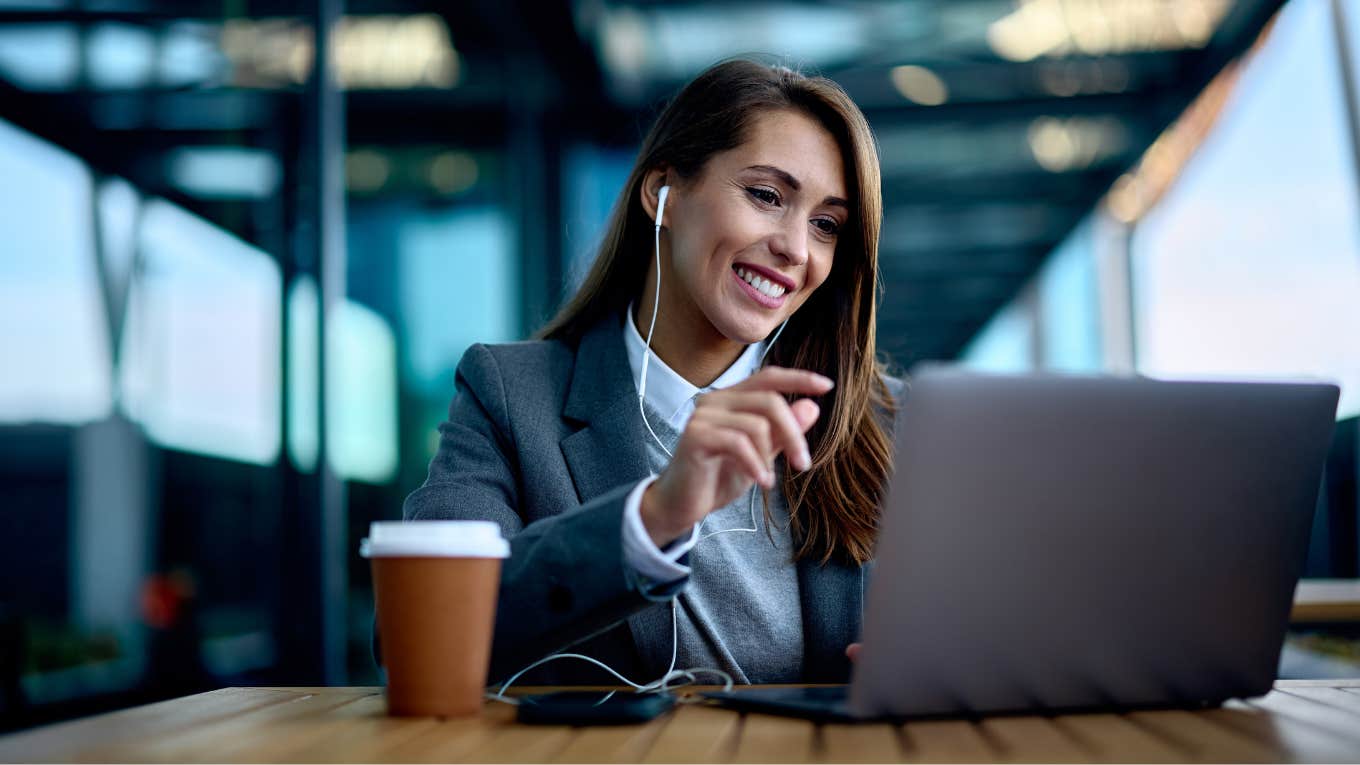 Woman working in airport during a business trip.