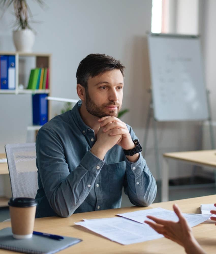 Boss stares intensely at applicant during interview