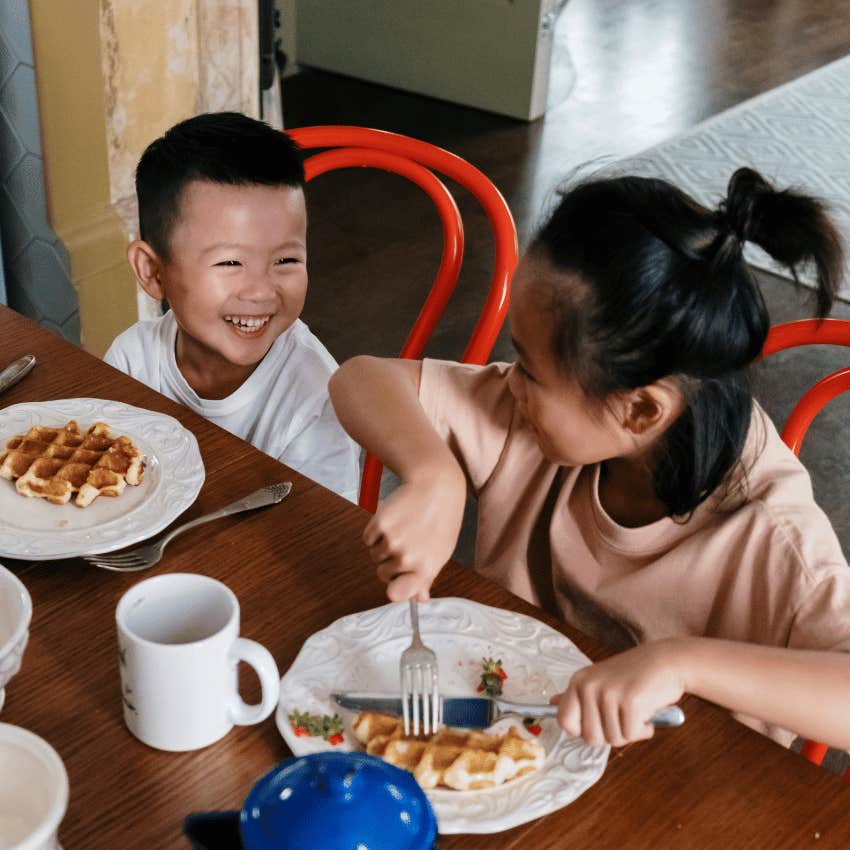 boy and girl eating breakfast