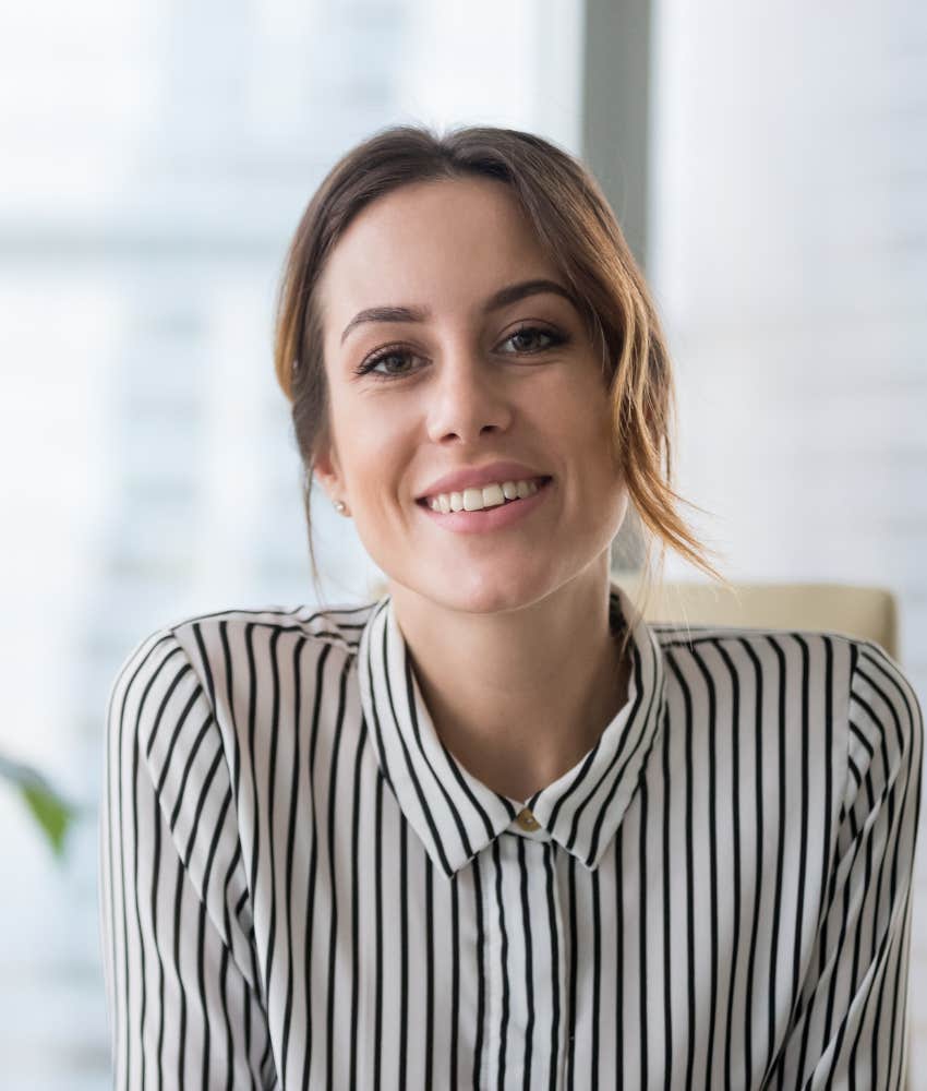 female interview candidate smiling calmly