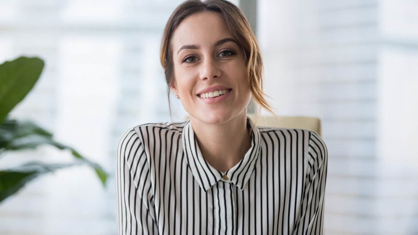 Woman smiling in a job interview.