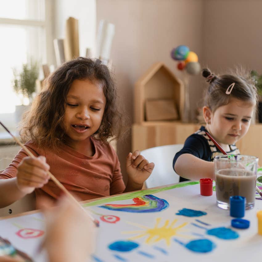 Children painting at childcare facility.