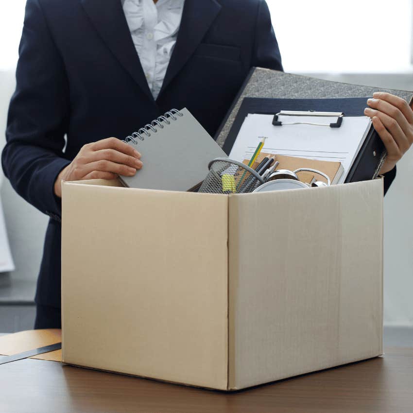 corporate woman packing belongings