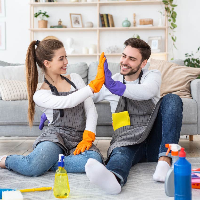 Couple cleaning and focusing on partnership