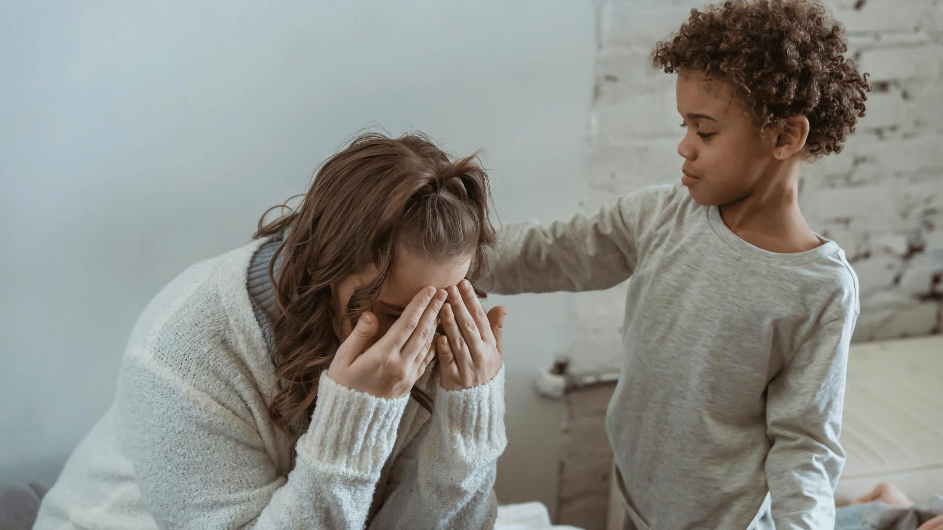 woman crying with son