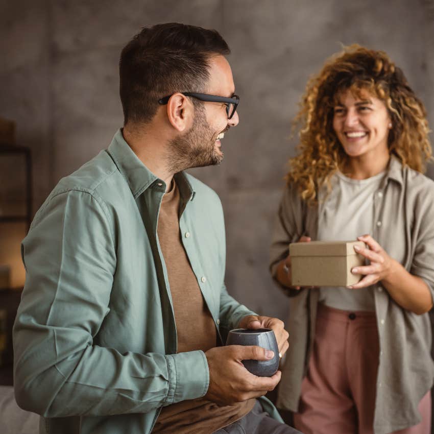 Woman gifts boyfriend a birthday present. 