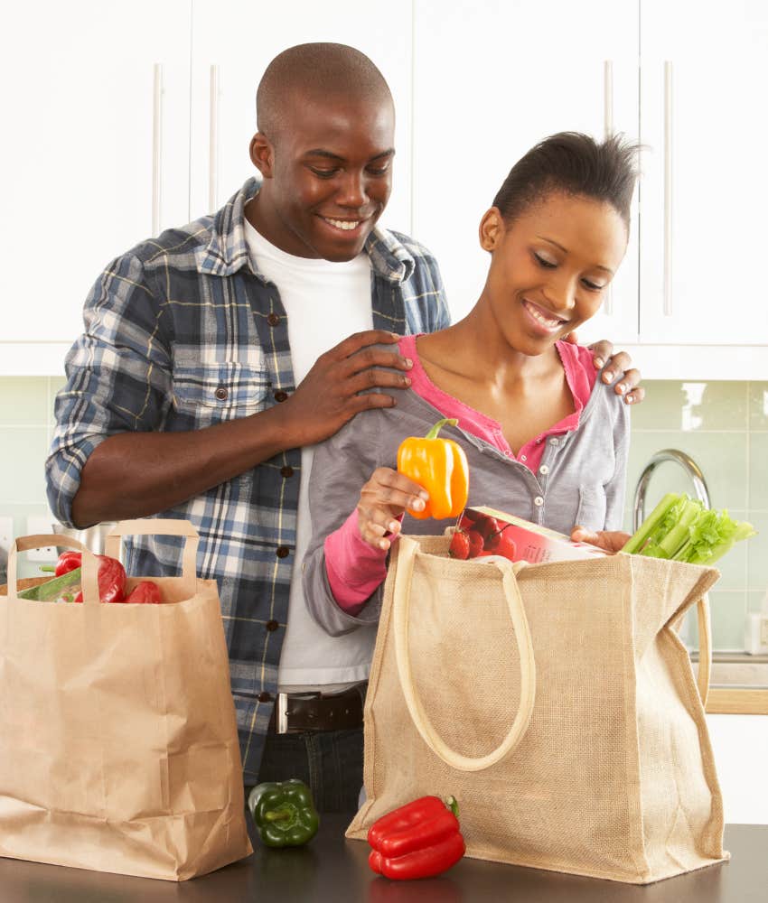 couple putting groceries away