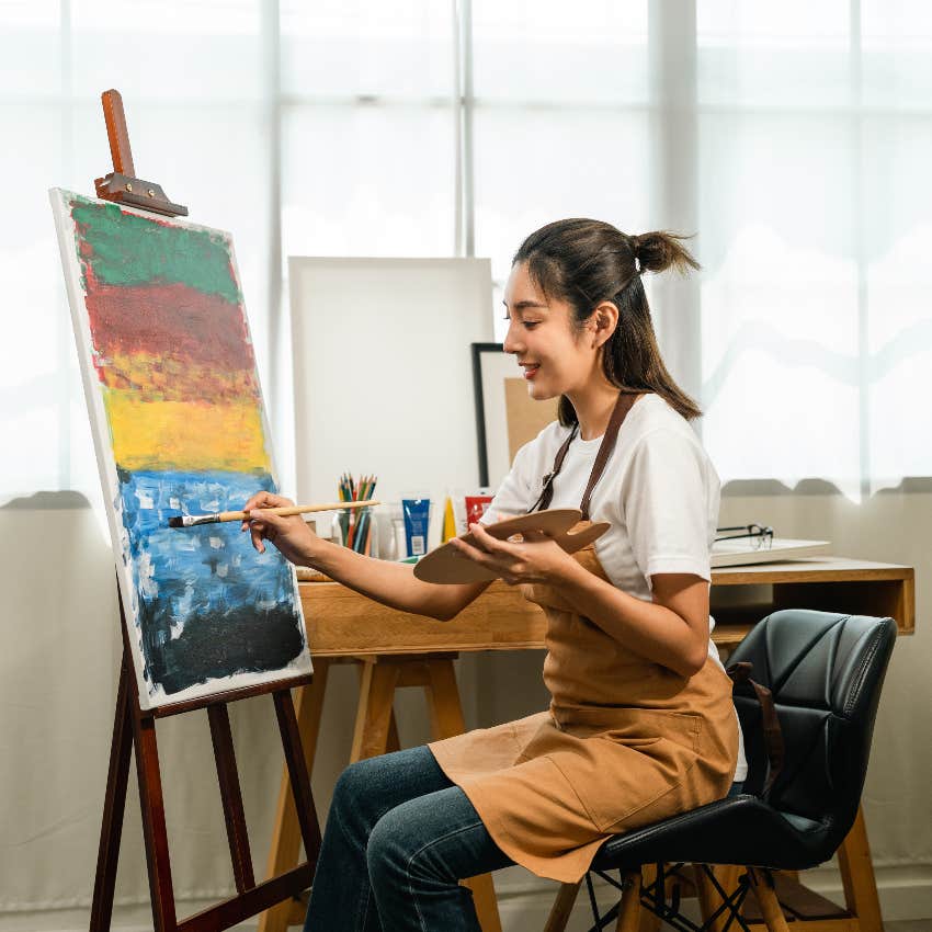 Creative woman painting to have more self-confidence