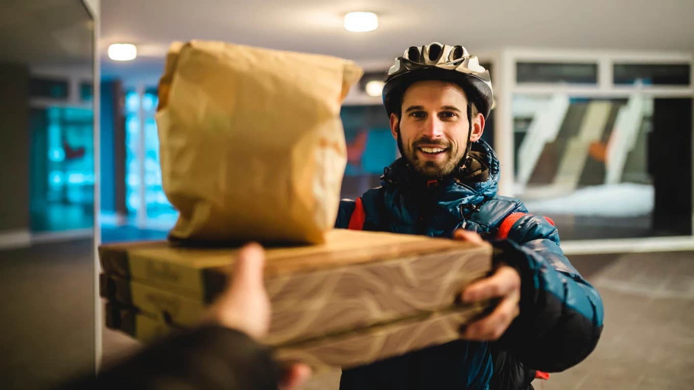 Delivery driver bringing food to customer