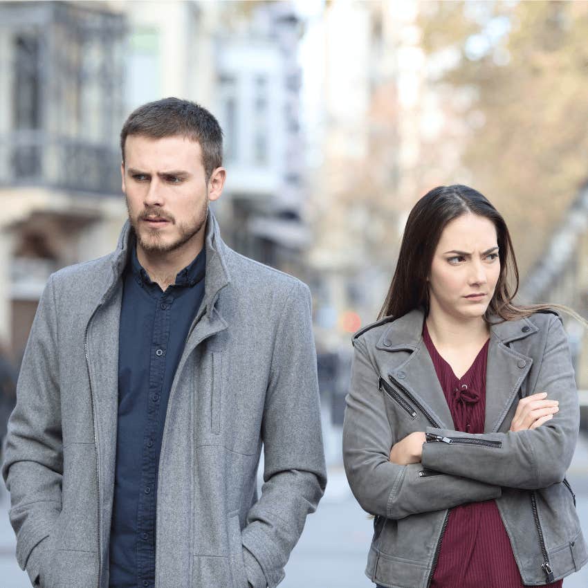 tense couple walking together