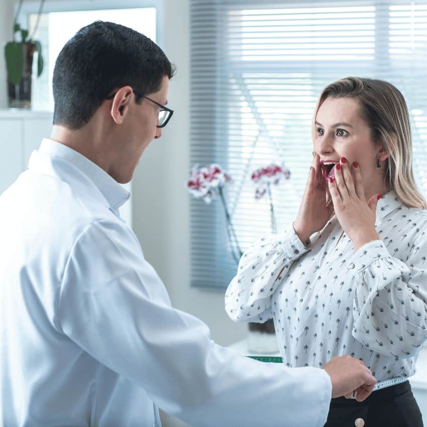 doctor measuring woman's waist for weight loss