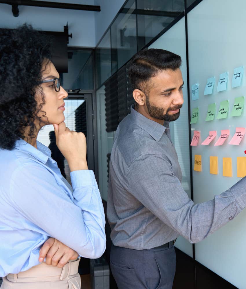 employees using sticker chart in an office