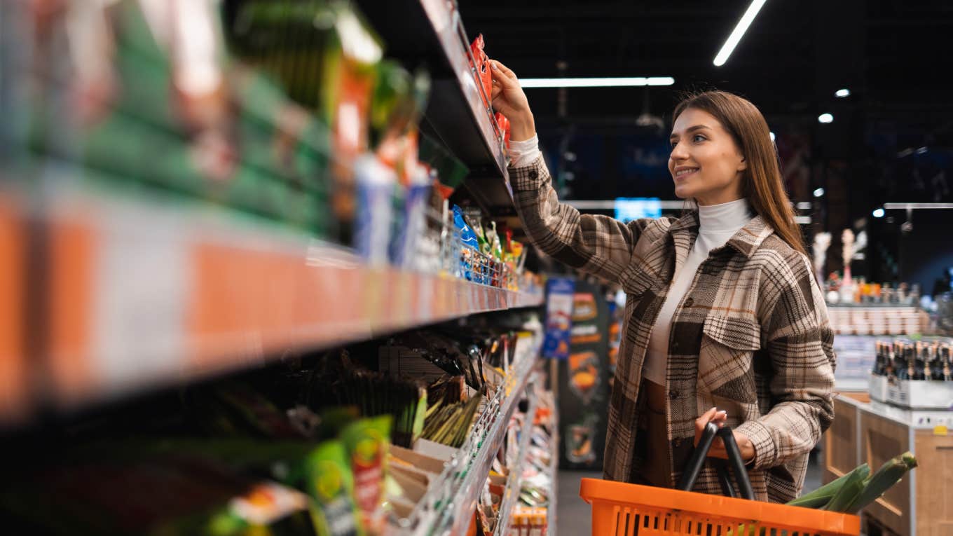 woman buying food at grocery store