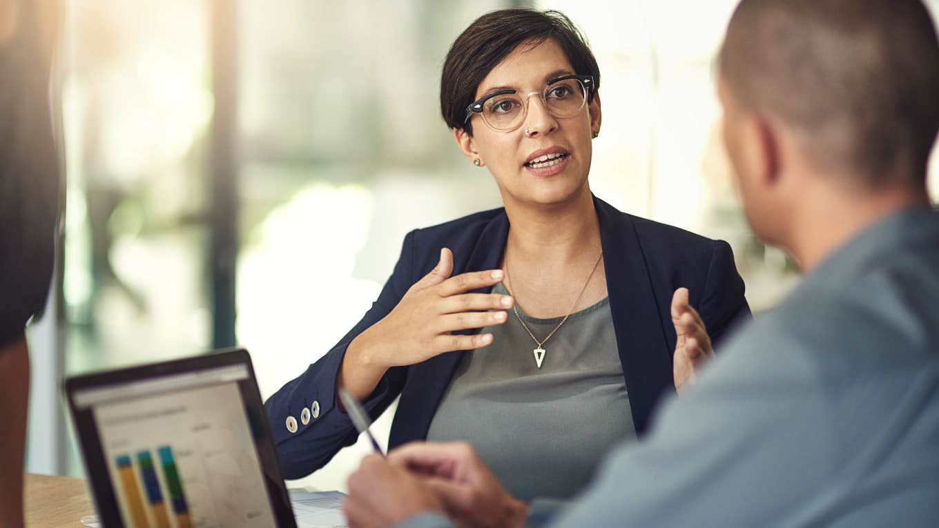 Woman using vocal cues while speaking to her manager.