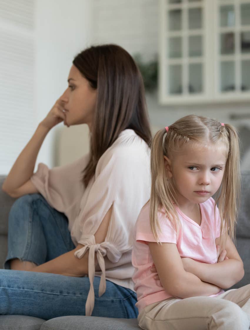 Mother and daughter negatively face away and don't talk at home