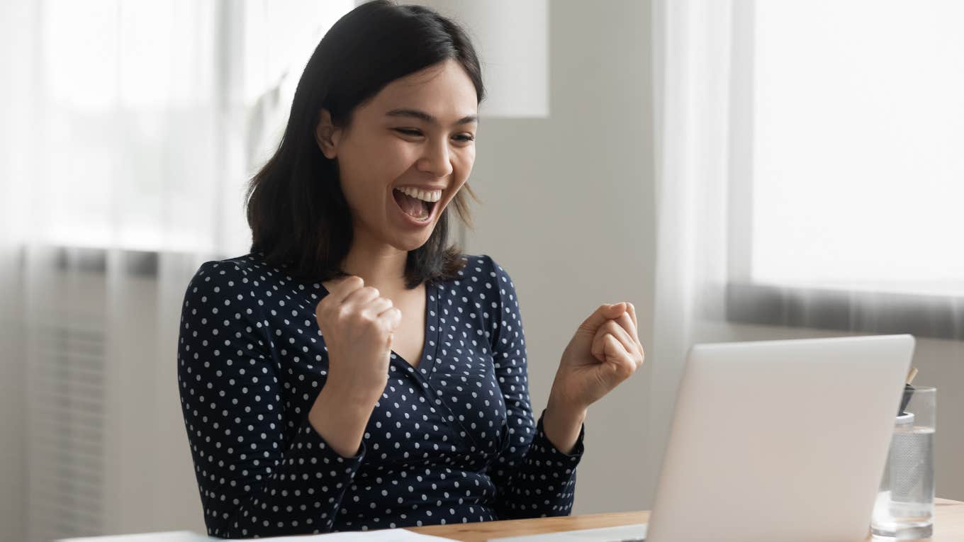 Woman getting a promotion looking excited and happy. 